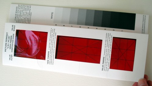 Folded over Picture Perfect View Finder showing the red gel and composition grids.